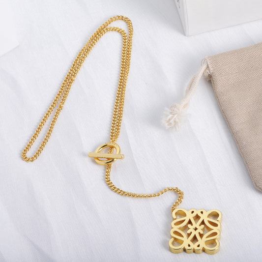 Gold square cutout logo pendant necklace on link chain
