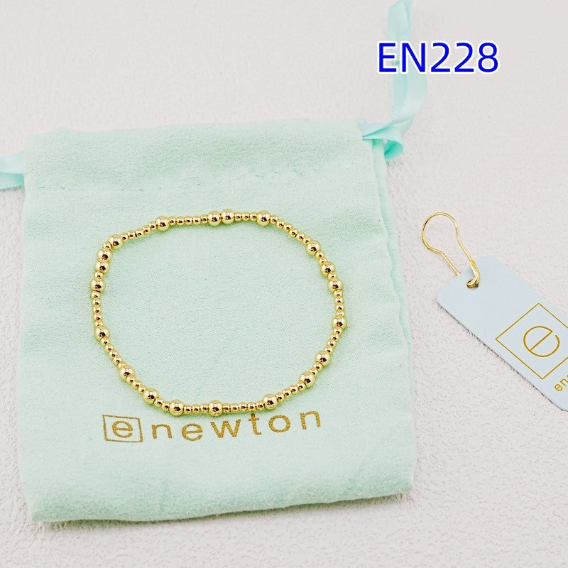 Gold beaded metal bracelet with small round bead chain
