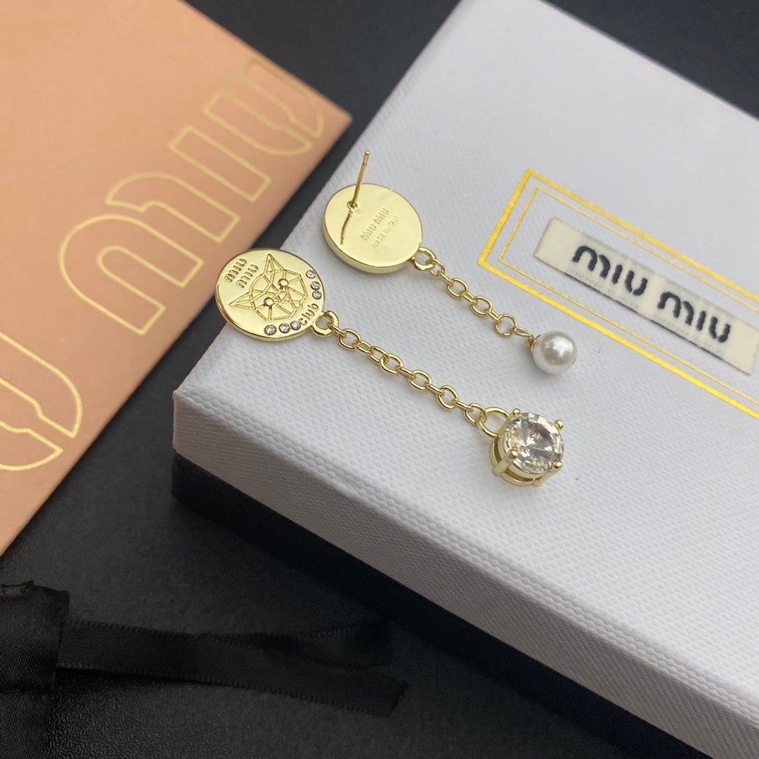 Gold asymmetric drop earrings: engraved coin, pearl bead, clear crystal charm