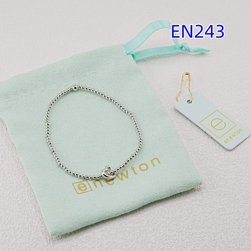 Silver-tone heart-pendant beaded bracelet with heart clasp charm