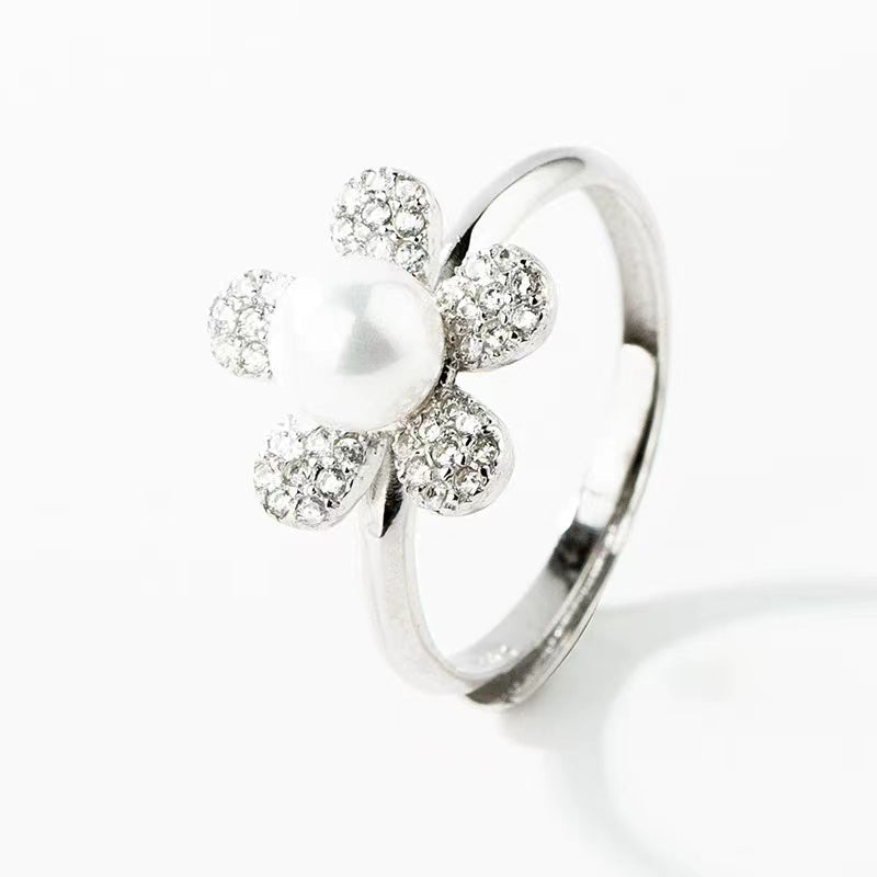 silver flower with pearl ring