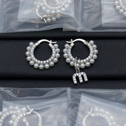 White gold pearl and crystal hoop earrings with dangling letter charm