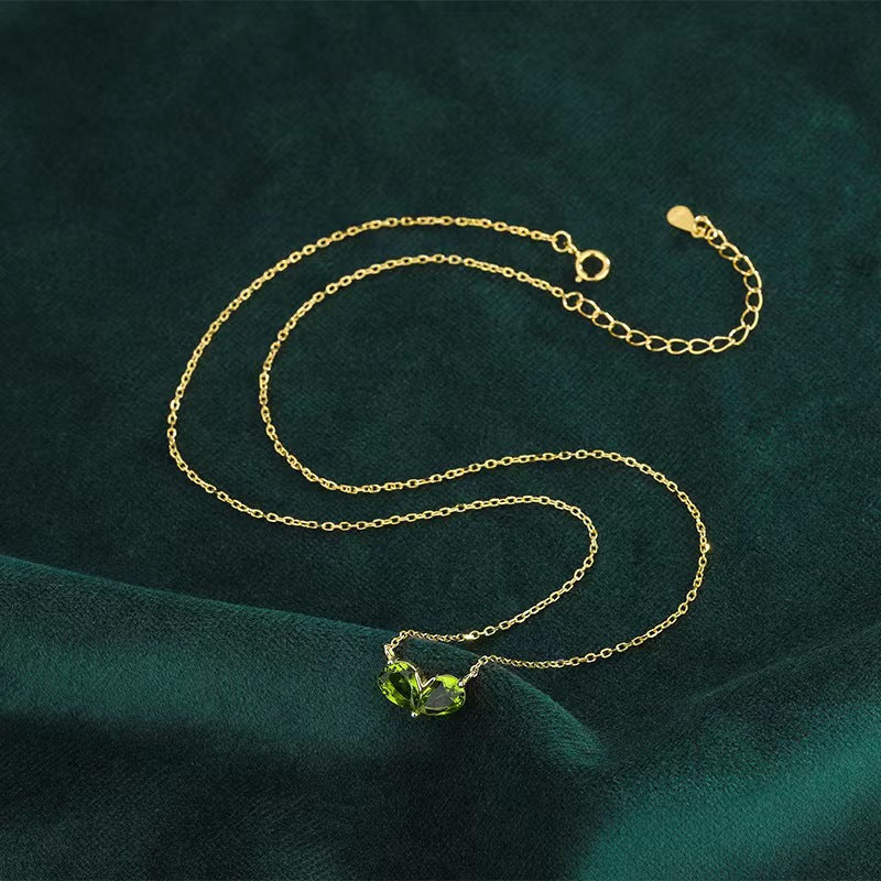 gold color green diamond heart necklace