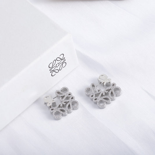 White-gold-tone geometric hollow diamond stud earrings, pair view