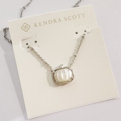 Silver necklace with white pumpkin pendant and small dangling stud earrings