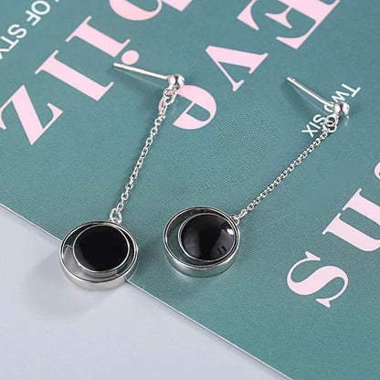 black coin with circle stud earrings