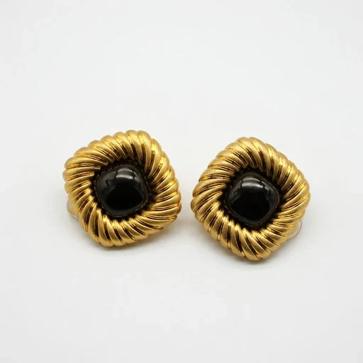 Gold-tone scalloped stud earrings with black cabochon centers, pair