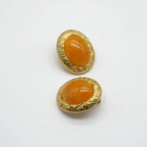 Gold-tone bezel yellow oval glass stud earrings, textured frame, minimal antique style
