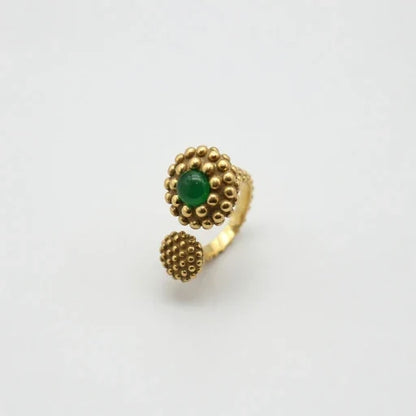 Gold-tone textured ring with oval green stone, raised bubble setting