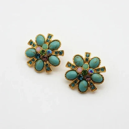 Pair of gold-tone flower stud earrings with turquoise and purple gemstone inlays