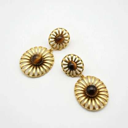 Gold-tone sunburst drop earrings with dark brown cabochon discs and small top studs