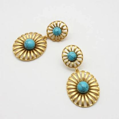 Gold-tone sunburst drop earrings with bright turquoise cabochon discs and small top studs