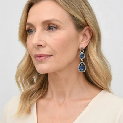 Antique silver-tone blue teardrop drop earrings with oval blue cabochon