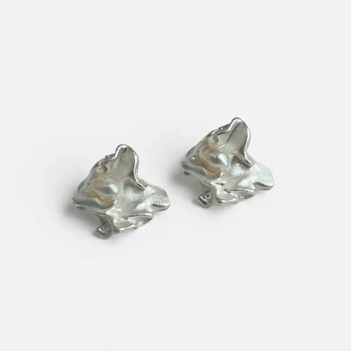 Pair of silver-tone freshwater pearl stud earrings with irregular sculpted shape