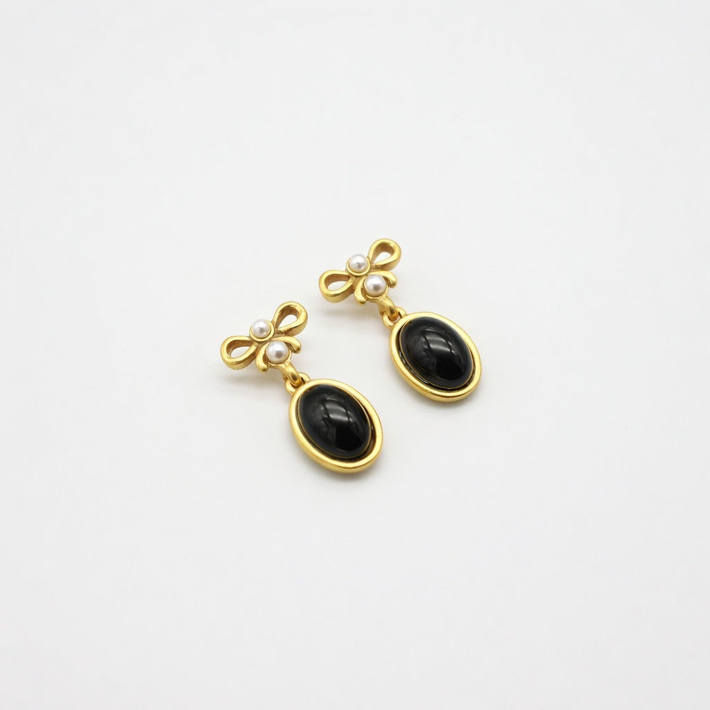Vintage black oval glass drop earrings with gold bow tops and pearl accents