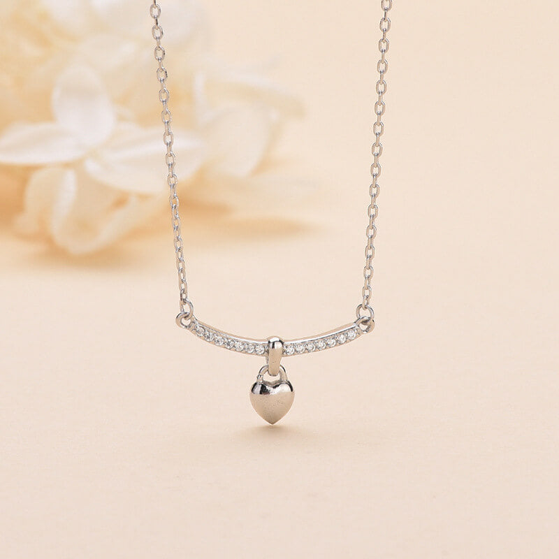 diamond bar and heart pendant