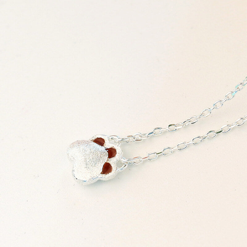 silver paw pendant