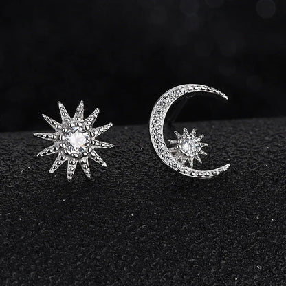Crescent moon and star diamond stud earrings in silver tone with pavé detailing