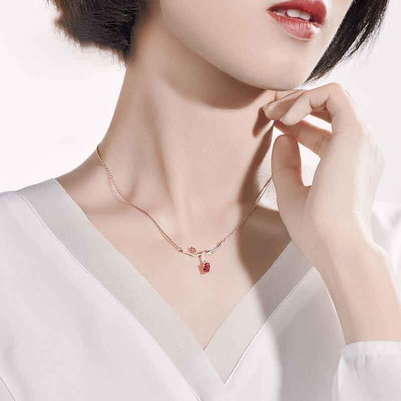 branches with ruby pendant