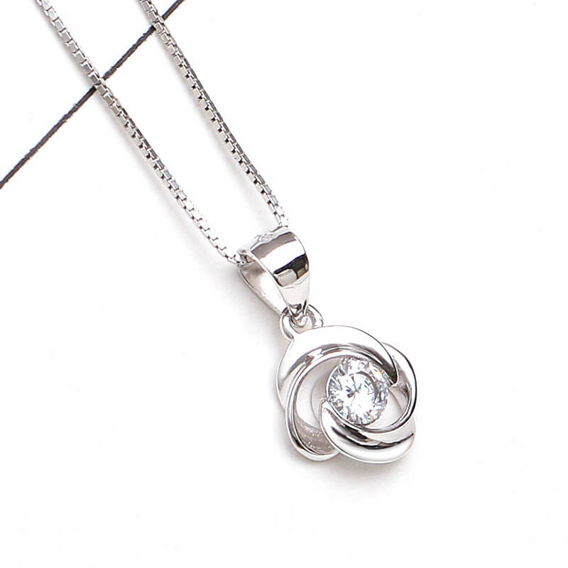 clover rotating necklace and silver