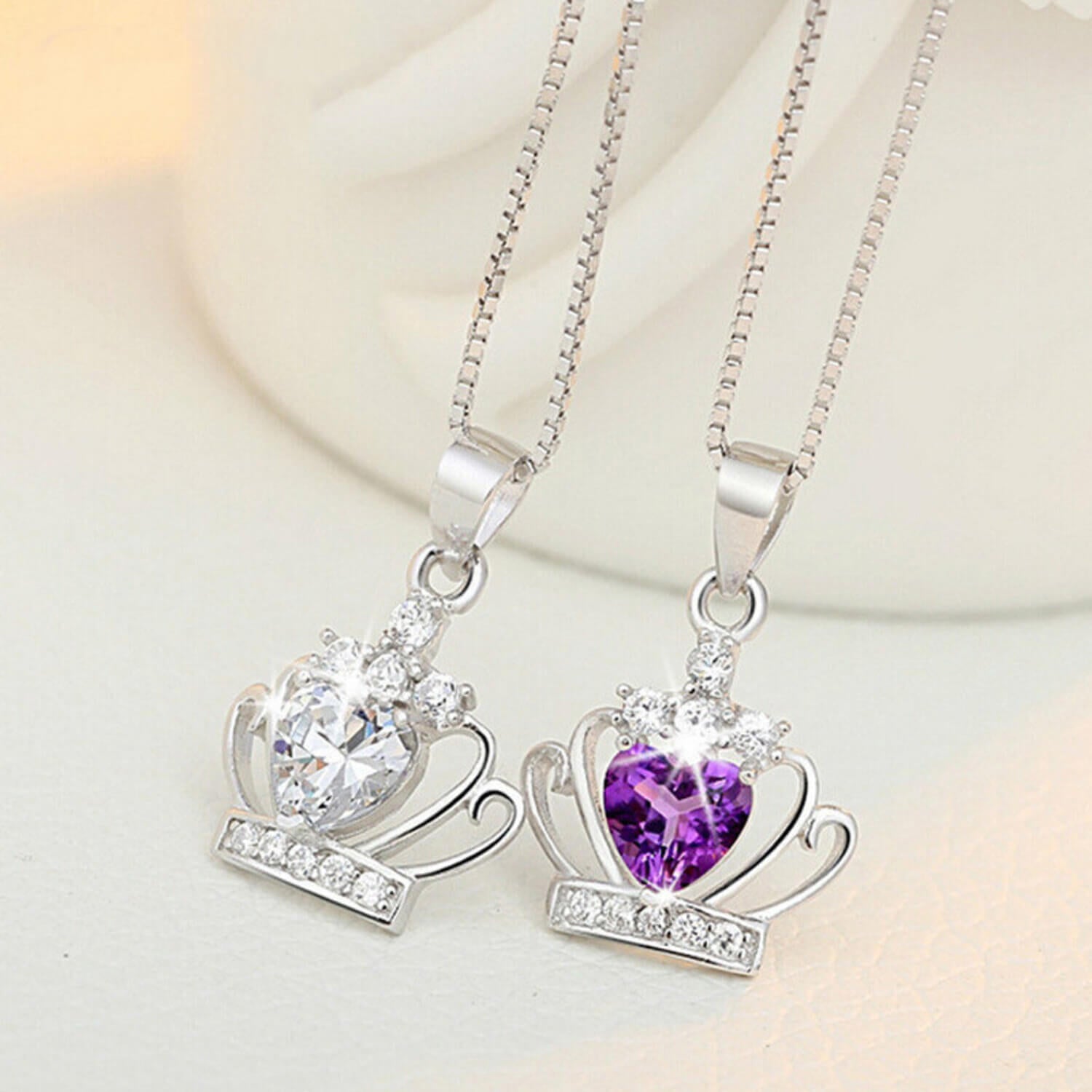 whit and purple diamond crown necklace